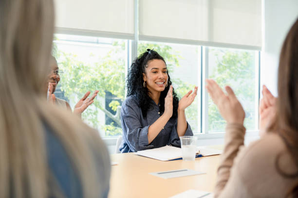 istock Diverse Group of Women Applauding in Meeting 2201100604