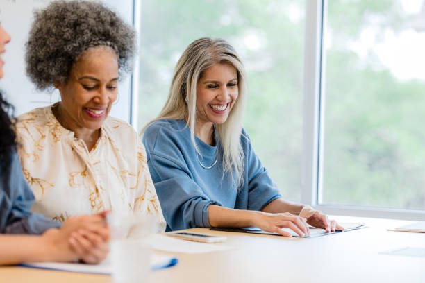 istock Happy Diverse Women in a Business Meeting 2201100609