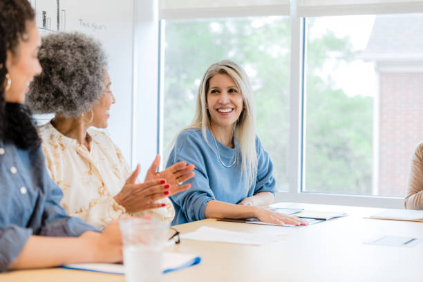 istock Three Diverse Women in a Meeting, Discussing Ideas 2201100617