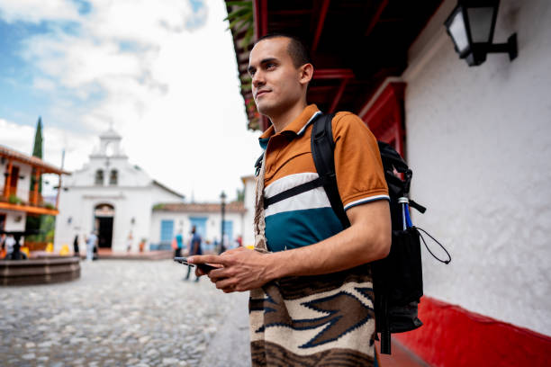 istock Young man looking around in Medellin, Colombia 2201100782