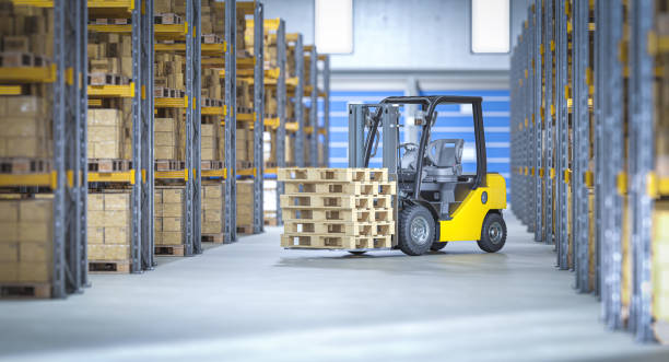 istock Forklift carrying wooden pallets in a distribution warehouse 2201100852