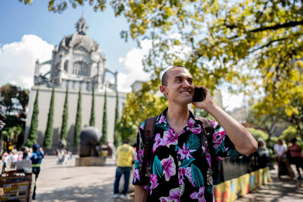 istock Young man talking on phone in Medellin, Colombia 2201100964