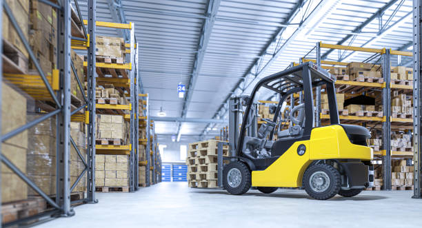 istock Forklift carrying wooden pallets in a modern warehouse 2201101826