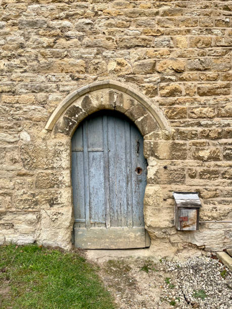 istock Ancient Arched Door In Stone Building, Northamptonshire, England 2201102426