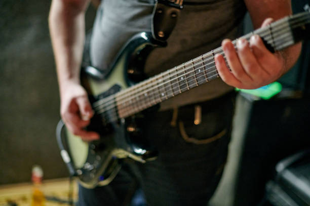 istock Close up of Electric Guitar Playing Hands 2201103282
