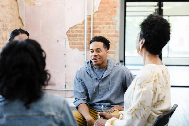 istock Group therapy session:  Diverse people discussing mental health and wellbeing 2201105415