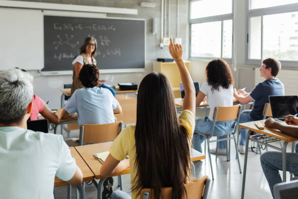 istock Young group of multiracial students attending teacher in class at high school. 2201106038