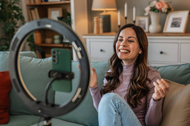 istock Happy woman, influencer and phone with ring light for video recording 2201106936