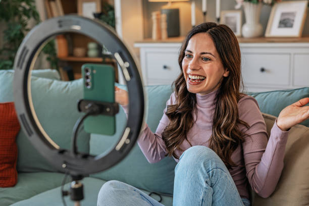 istock Happy woman, influencer and phone with ring light for video recording 2201106937