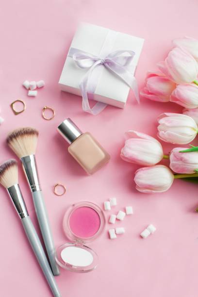 istock Cosmetics, decorations, a bouquet of tulips on a pink background. Gift. A box with a gift. International Women's Day. Holidays. Spring. 2201106938