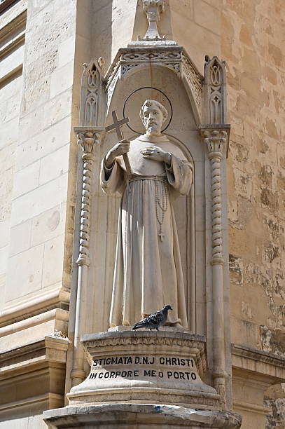 A digitally altered background photo of a Saint Francis of Assisi garden statue.