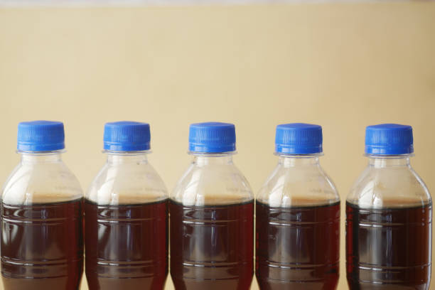 Close up of brown glass milk bottle on white background