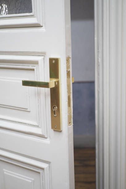 istock An Elegant Open Door Featuring a Beautiful Brass Handle Bathed in Soft Lighting Atmosphere 2201111685