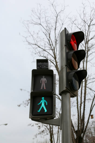 istock Traffic light on a street in Madrid, in its different colors and figures, whether red, green, amber or the pedestrian crossing. 2201112008