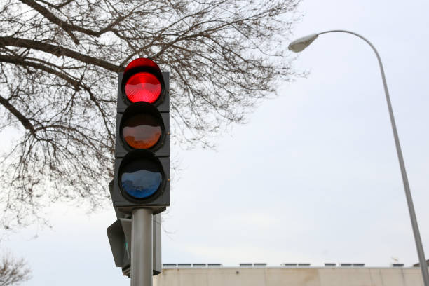 istock Traffic light on a street in Madrid, in its different colors and figures, whether red, green, amber or the pedestrian crossing. 2201112010