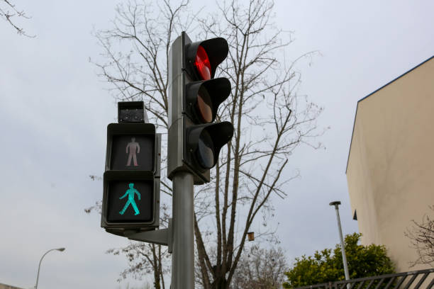 istock Traffic light on a street in Madrid, in its different colors and figures, whether red, green, amber or the pedestrian crossing. 2201112018