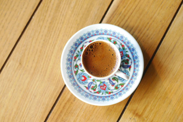 istock Turkish Coffee in Floral Cup on Checkered Tablecloth 2201112465