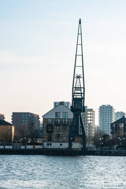istock Old crane towering over millwall dock in london's docklands 2201113588