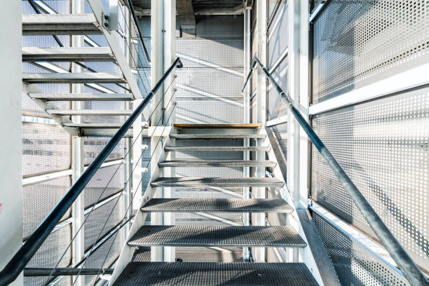 istock Metal staircase with perforated metal cladding in modern building 2201113655