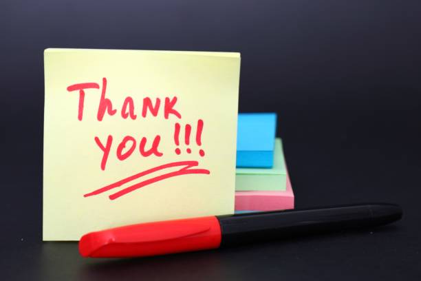 istock inscription - thank you, on a yellow sticker 2201115597