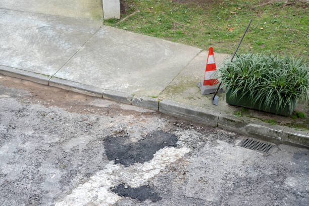 istock Damaged public road undergoing maintenance and resurfacing. The deteriorated asphalt with potholes and cracks is prepared for renovation to improve traffic safety and urban infrastructure. 2201116355