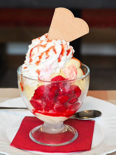 istock vanille ice cream with hot rasberries 2201116603