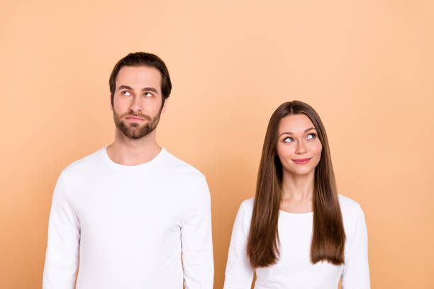 istock Portrait of attractive minded curious brown-haired people thinking copy space isolated over beige pastel color background 2201119993