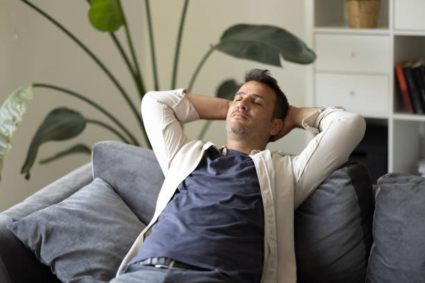 istock Happy handsome man resting and relaxing at home 2201121399