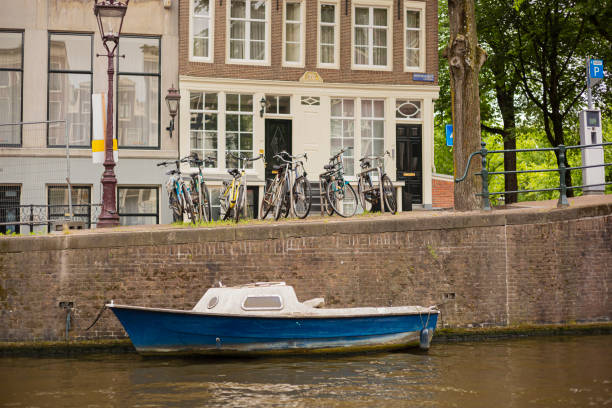 Amsterdam, Netherlands-June 11,2016:Unidentified Family enjoying boat ride at Amsterdam Harbor in a Warm Summer Day