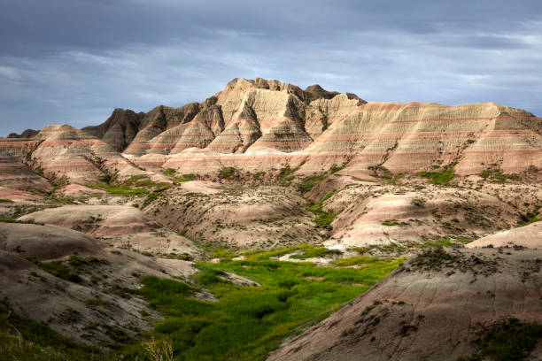 istock Dramatic Badlands National Park with Storm Clouds Over Rock Formations 2201126734