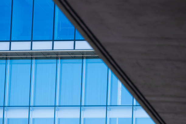 istock Glass and steel facade behind a bridge construction.. 2201128304