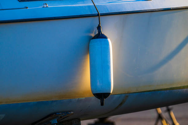 istock boat fender hanging against hull at sunset.. 2201130104