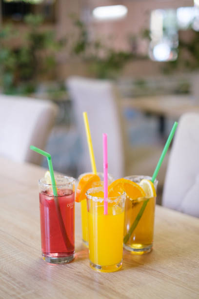 istock Refreshing summer drinks with citrus fruits served in glasses with straws 2201136780