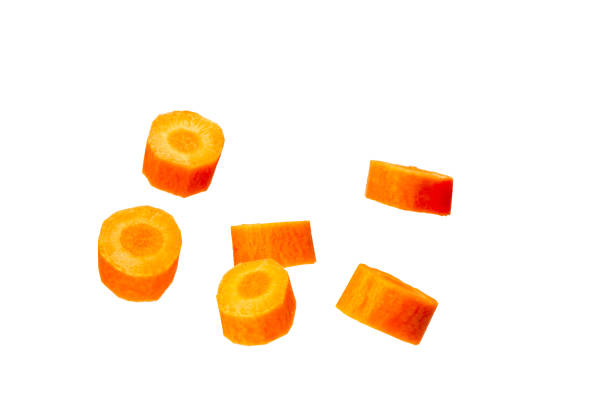 Falling Carrot slice isolated on white background, clipping path, full depth of field