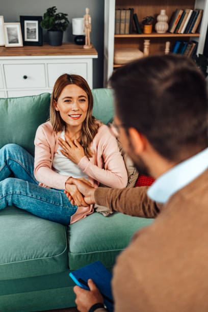 istock Young woman at psychotherapy session 2201143064