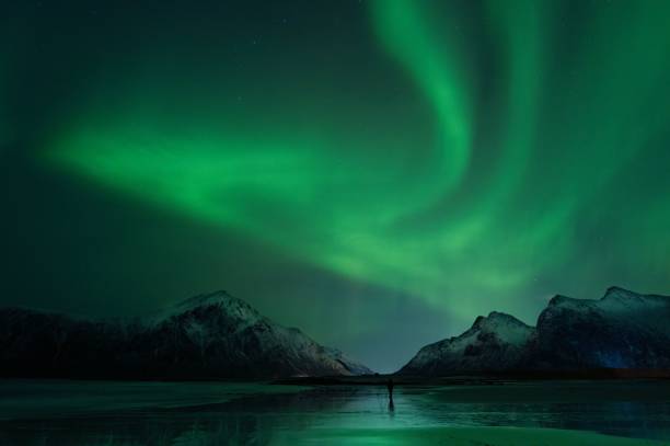 istock Northern Lights over Snowy Mountains 2201143398