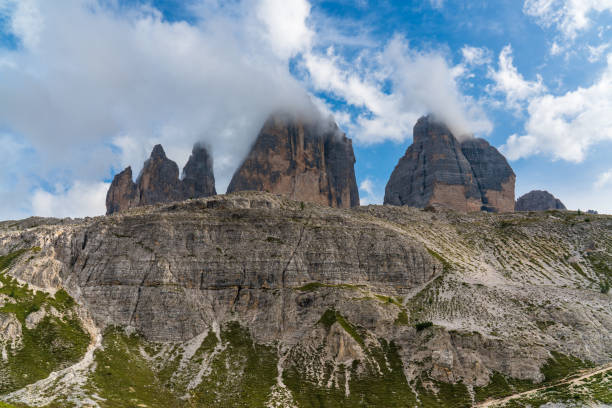 istock Iconic peaks Drei Zinnen (Tre Cime di Lavaredo) rise dramatically through misty clouds in Dolomites. Breathtaking and mystical mountain landscape showcasing power and beauty nature 2201143795