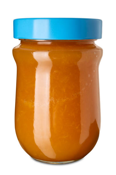 istock Apricot jam in glass jar with blue cap 2201146922