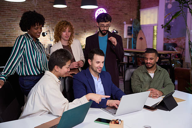 istock Diverse business team collaborating on laptop in modern office 2201155381
