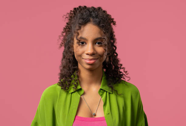 istock Young Charming African Woman With Kind Smile Looking To Camera On pink Studio 2201156254