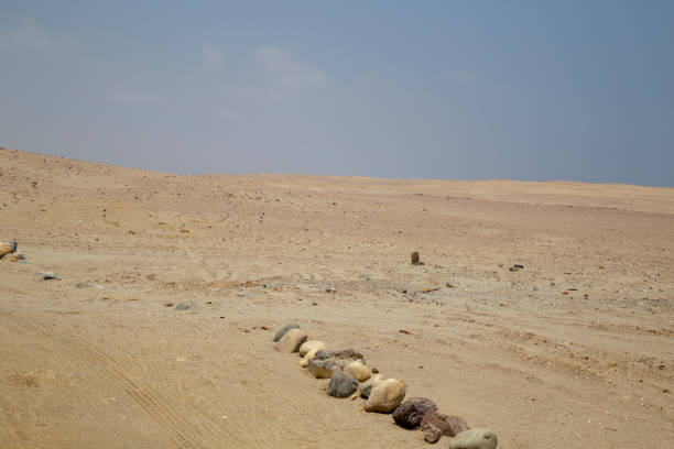Rocks lining an ancient cemetery in the arid paracas desert of peru