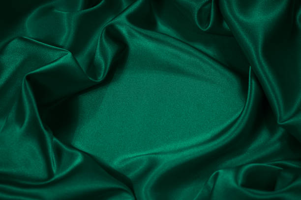 istock Dark emerald green silk satin fabric backdrop. Product space. Drapery. Show mockup presentation fashion show podium display . Beauty luxury festive cosmetics perfume decoration gift. Design. 2201162242
