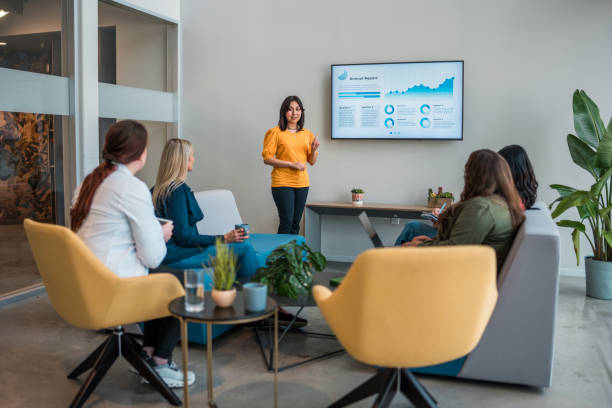 istock Hispanic Businesswoman Leading Presentation in Modern Office 2201171756