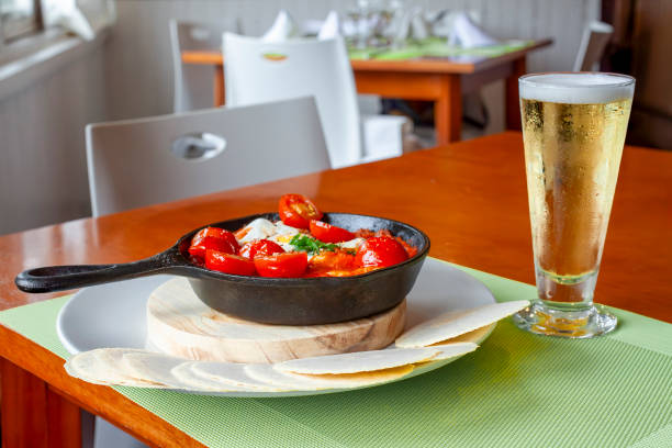 istock Shakshuka with pita bread and beer served in restaurant 2201172648