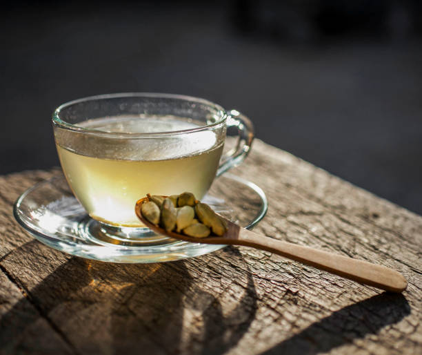 istock Cardamom tea brewing in glass cup on rustic wooden table 2201172747