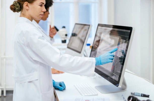 istock Young Female Researcher Analyzing Data in a University Science Laboratory 2201175992