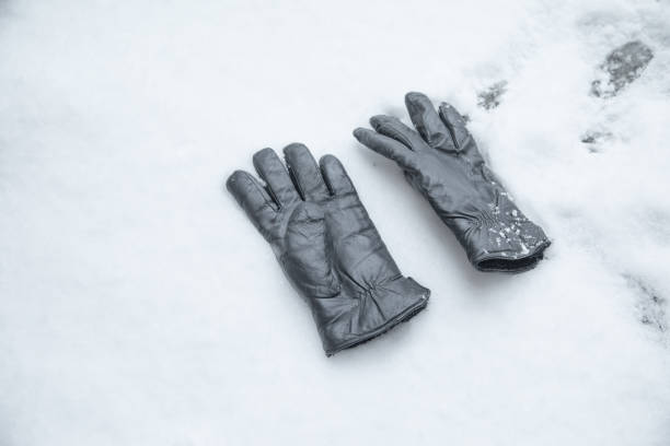 Winter leather gloves on the snow.