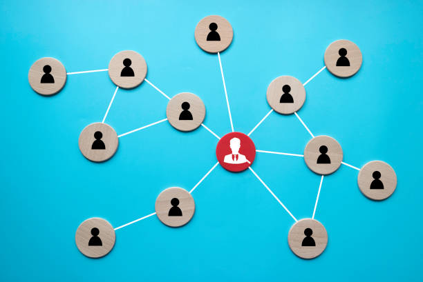 istock Business Network Concept with Central Leader and Connected Team Members on Blue Background 2201198948