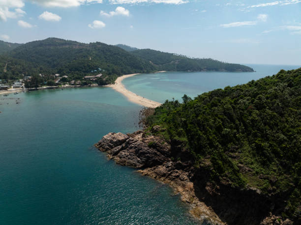 istock Sandy beach surrounded by green hills. Ko Pha Ngan, Thailand. 2201203265