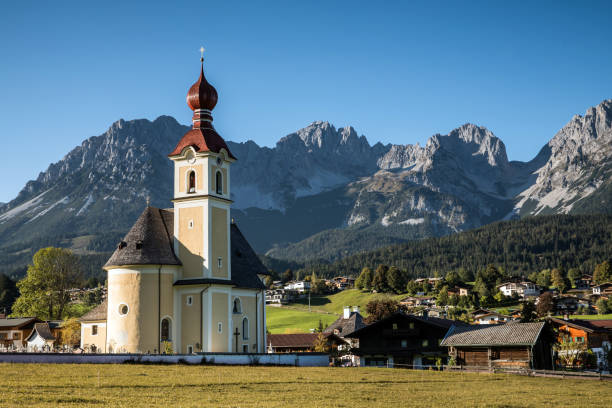 Idyllic church in the meadows of Going am Wilden Kaiser in the Kitzbühel Alps of Austria.